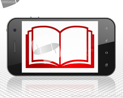 Image of Studying concept: Smartphone with Book on display
