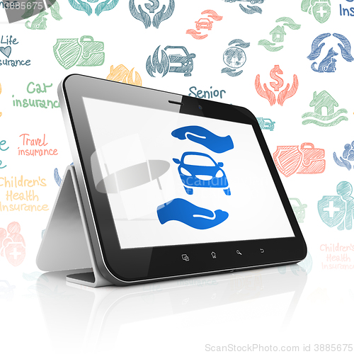 Image of Insurance concept: Tablet Computer with Car And Palm on display