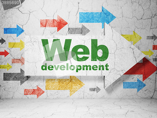 Image of Web design concept: arrow with Web Development on grunge wall background