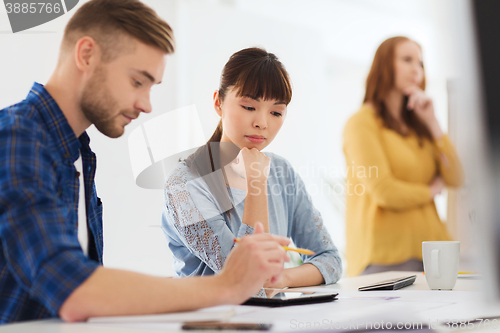 Image of creative team with tablet pc at office