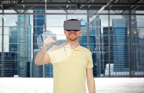 Image of happy man in virtual reality headset or 3d glasses