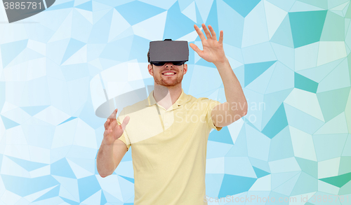 Image of happy man in virtual reality headset or 3d glasses