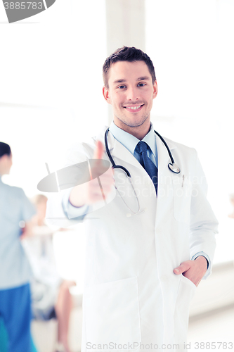 Image of doctor with stethoscope showing thumbs up