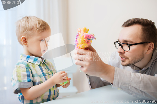 Image of father and son playing with ball clay at home