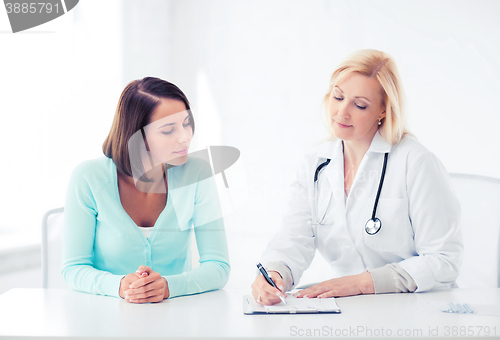 Image of doctor with patient in hospital