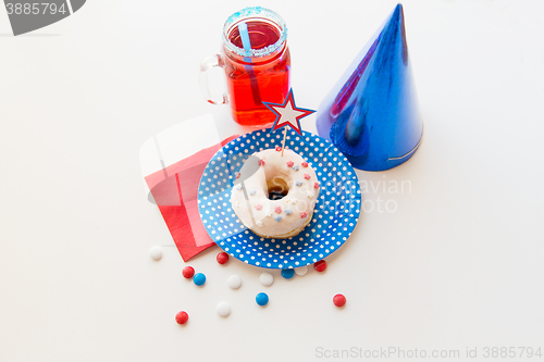 Image of donut with juice and candies on independence day