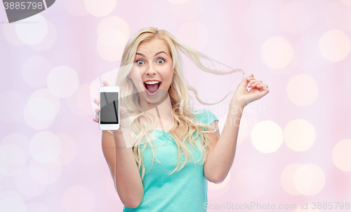 Image of happy young woman or teenage girl with smartphone