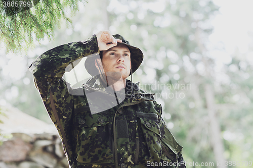 Image of young soldier or ranger in forest