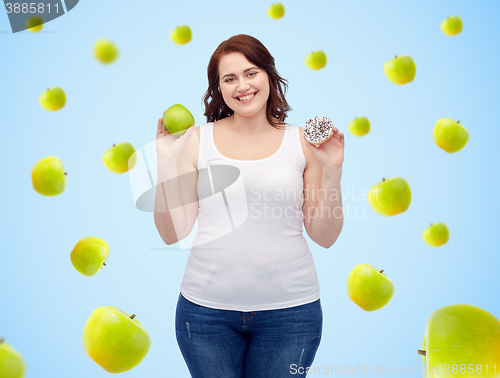 Image of happy plus size woman choosing apple or donut