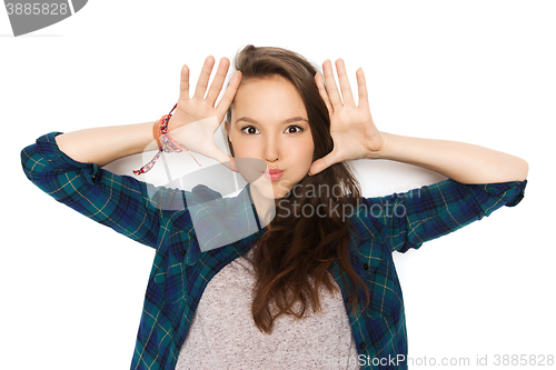 Image of happy teenage girl making face and having fun