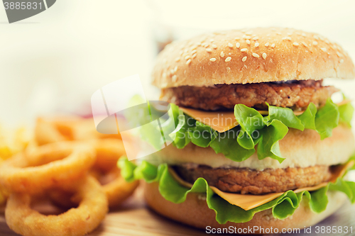 Image of close up of hamburger or cheeseburger on table