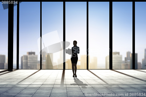 Image of silhouette of business woman with folders