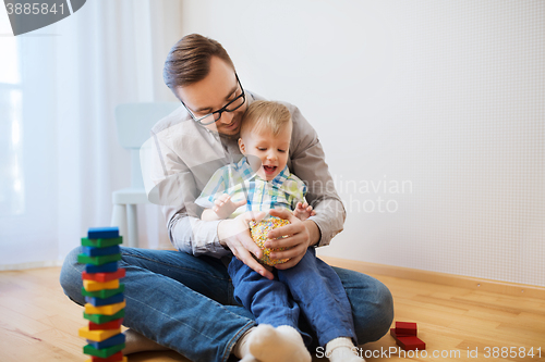 Image of father and son playing with ball clay at home