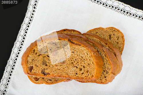 Image of Freshly baked bread with homespun fabric 