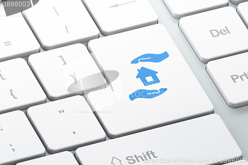 Image of Insurance concept: House And Palm on computer keyboard background