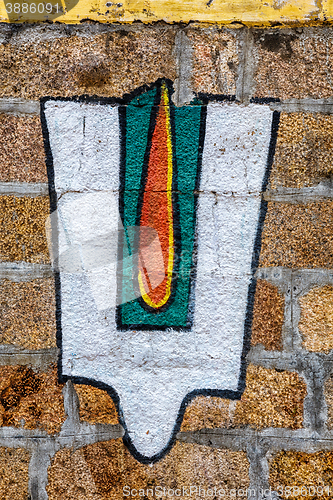 Image of Vushnu symbol on Hindu temple wall