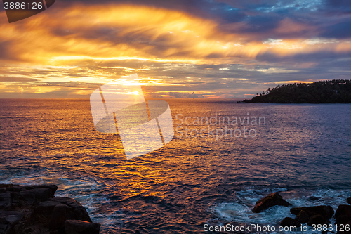 Image of Ocean sunset with dramatic sky