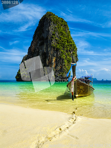 Image of Long tail boat on beach, Thailand