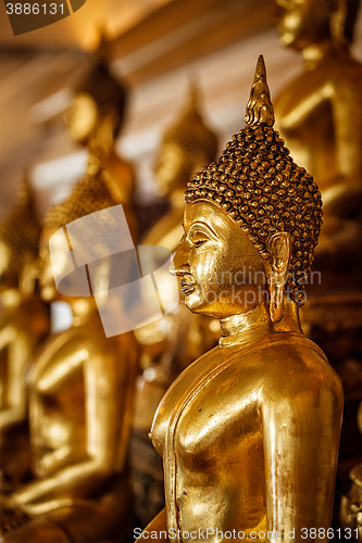 Image of Golden Buddha statues in buddhist temple