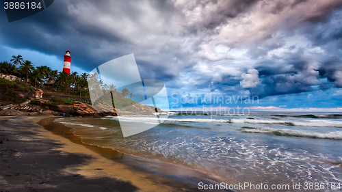 Image of Gathering storm, beach, lighthouse. Kerala, India