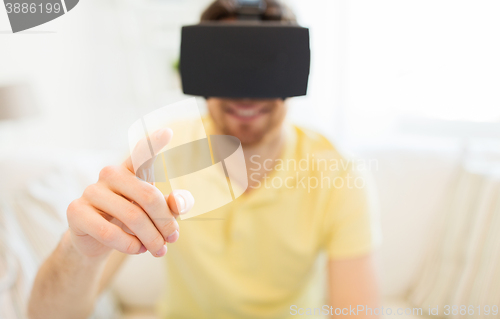 Image of young man in virtual reality headset or 3d glasses