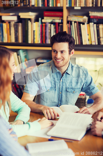 Image of students with books preparing to exam in library