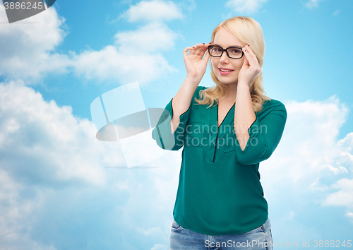 Image of smiling young woman with eyeglasses