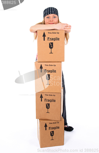 Image of Girl with a stack of cardboard boxes