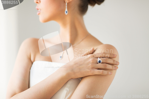 Image of close up of beautiful woman with finger ring