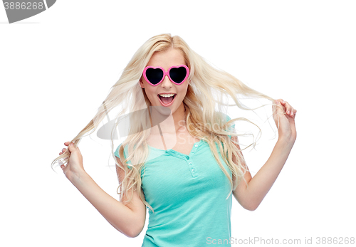 Image of happy young blonde woman or teenager in sunglasses