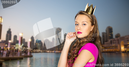 Image of young woman or teen girl in pink dress