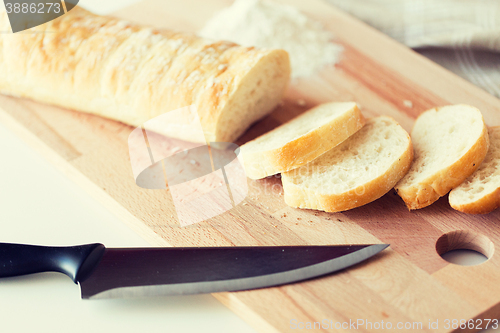 Image of close up of white bread or baguette and knife