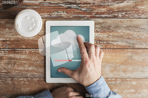 Image of close up of hands with tablet pc transferring data