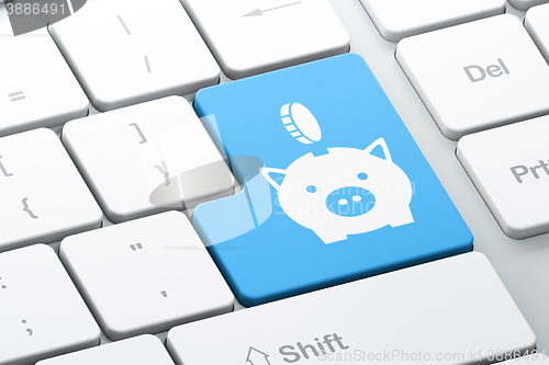 Image of Money concept: Money Box With Coin on computer keyboard background