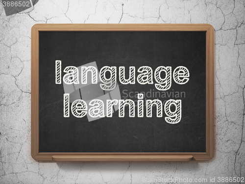 Image of Learning concept: Language Learning on chalkboard background