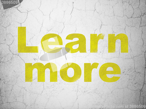 Image of Learning concept: Learn More on wall background