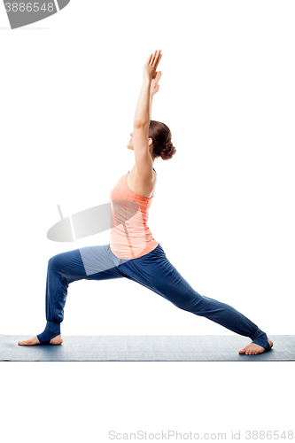 Image of Sporty woman practices yoga asana 