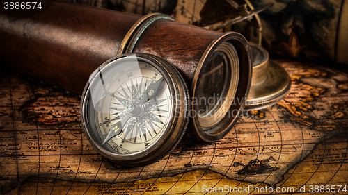 Image of Old vintage compass on ancient map