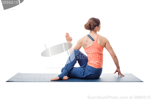 Image of Sporty fit yogini woman practices yoga asana