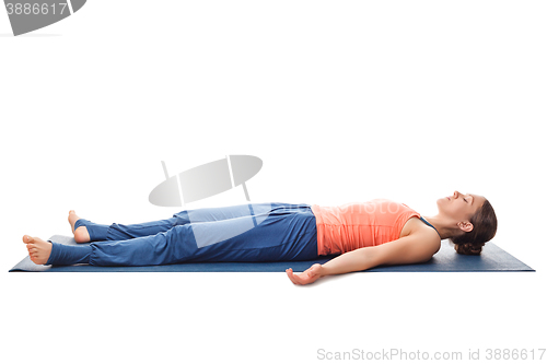 Image of Sporty fit yogi girl relax in yoga asana Savasana