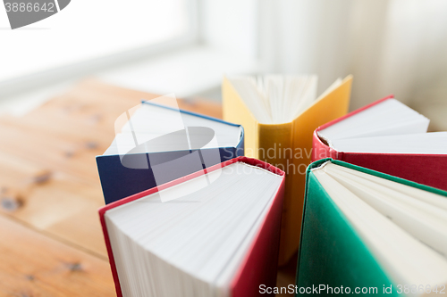 Image of close up of books on wooden table