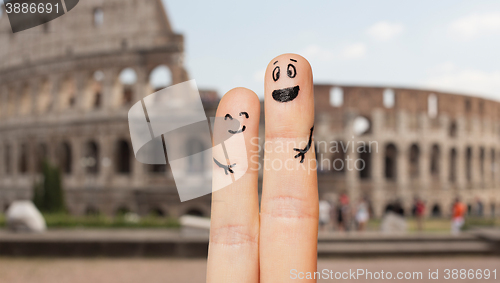 Image of close up of two fingers with smiley faces