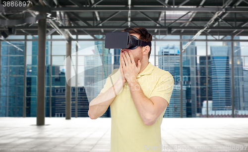 Image of happy man in virtual reality headset or 3d glasses