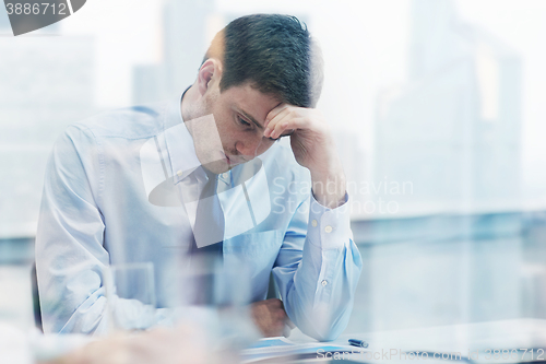 Image of businessman having problem in office