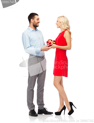 Image of happy couple with red heart shaped gift box