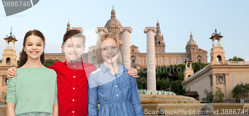 Image of happy boy and girls hugging