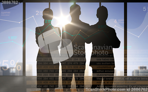 Image of business people silhouettes with chart and numbers