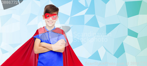 Image of boy in red super hero cape and mask