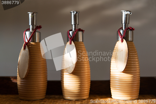 Image of close up of liquid soap or body lotion at bathroom