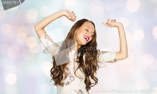 Image of happy young woman or teen girl in fancy dress